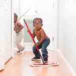 little boy mopping the floor